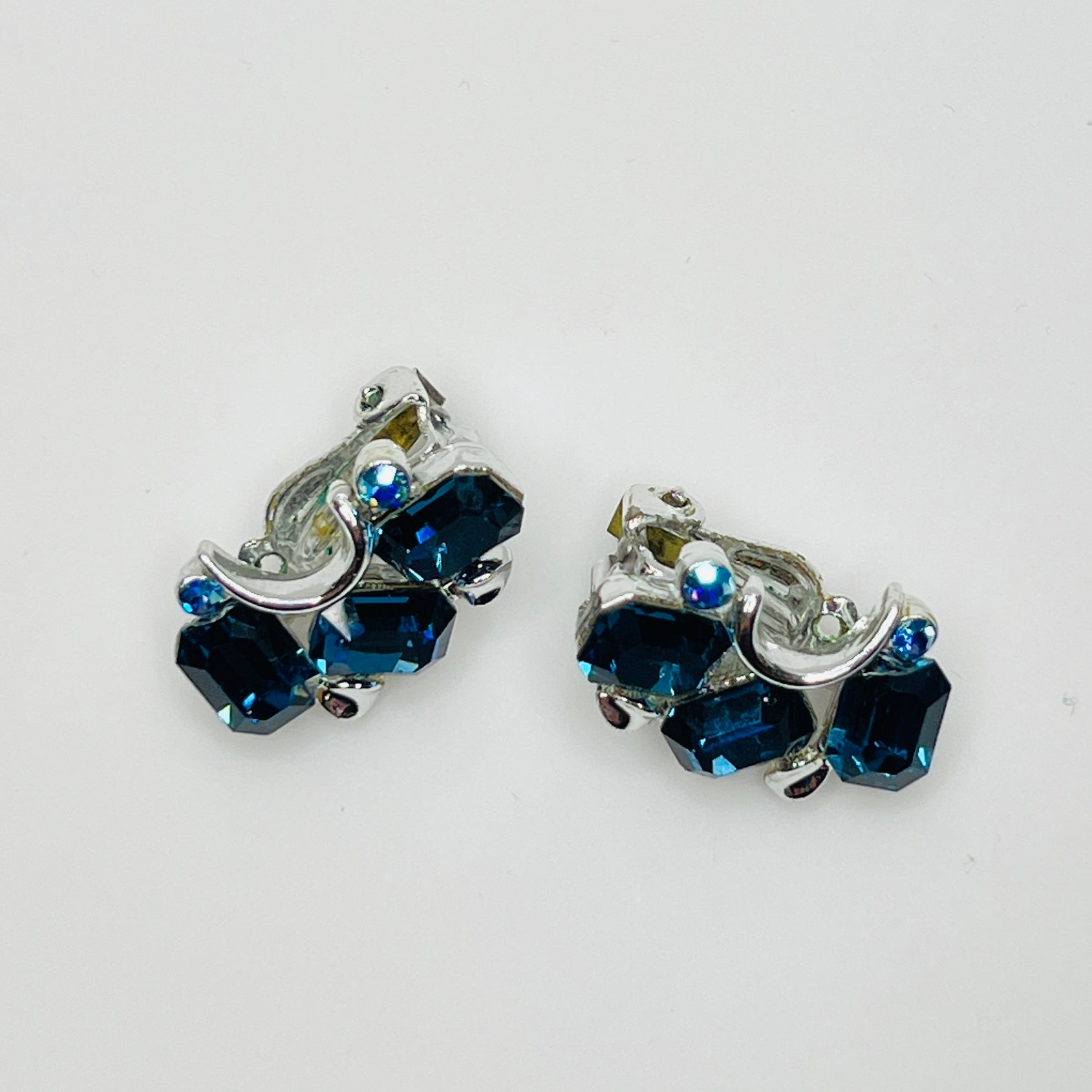 Lisner clip-on earrings with sapphire blue rhinestones and silver-tone setting