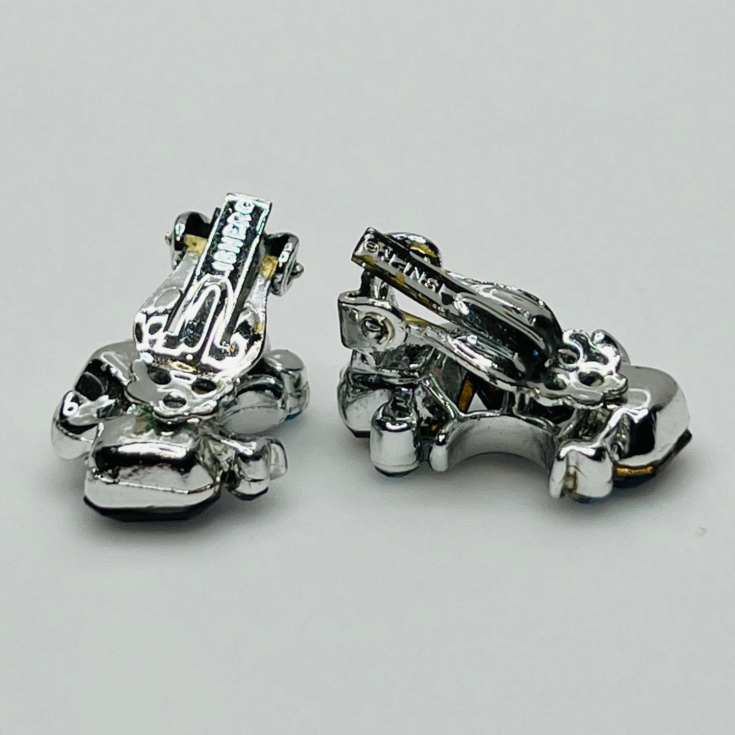 Lisner clip-on earrings with sapphire blue rhinestones and silver-tone setting