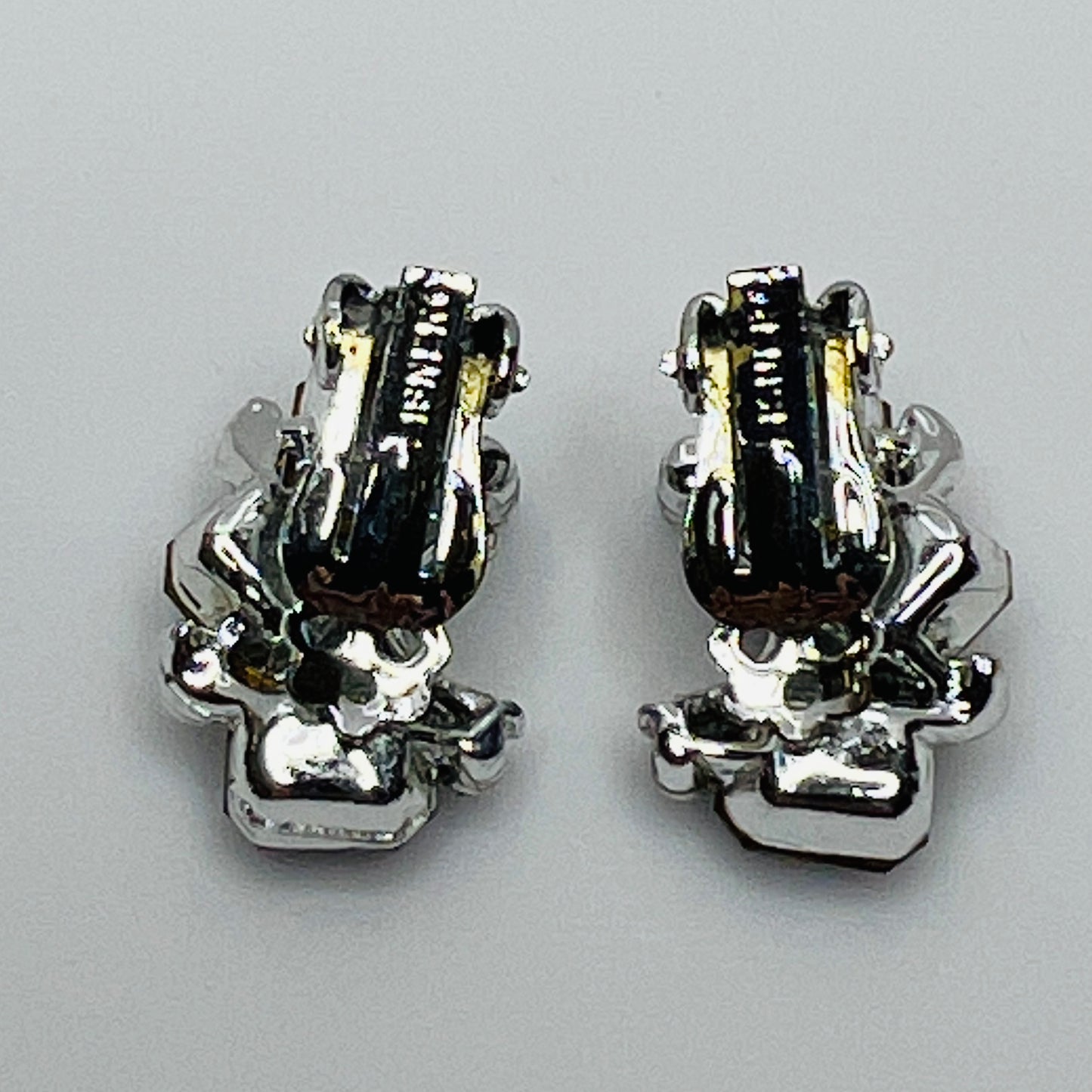 Lisner clip-on earrings with sapphire blue rhinestones and silver-tone setting