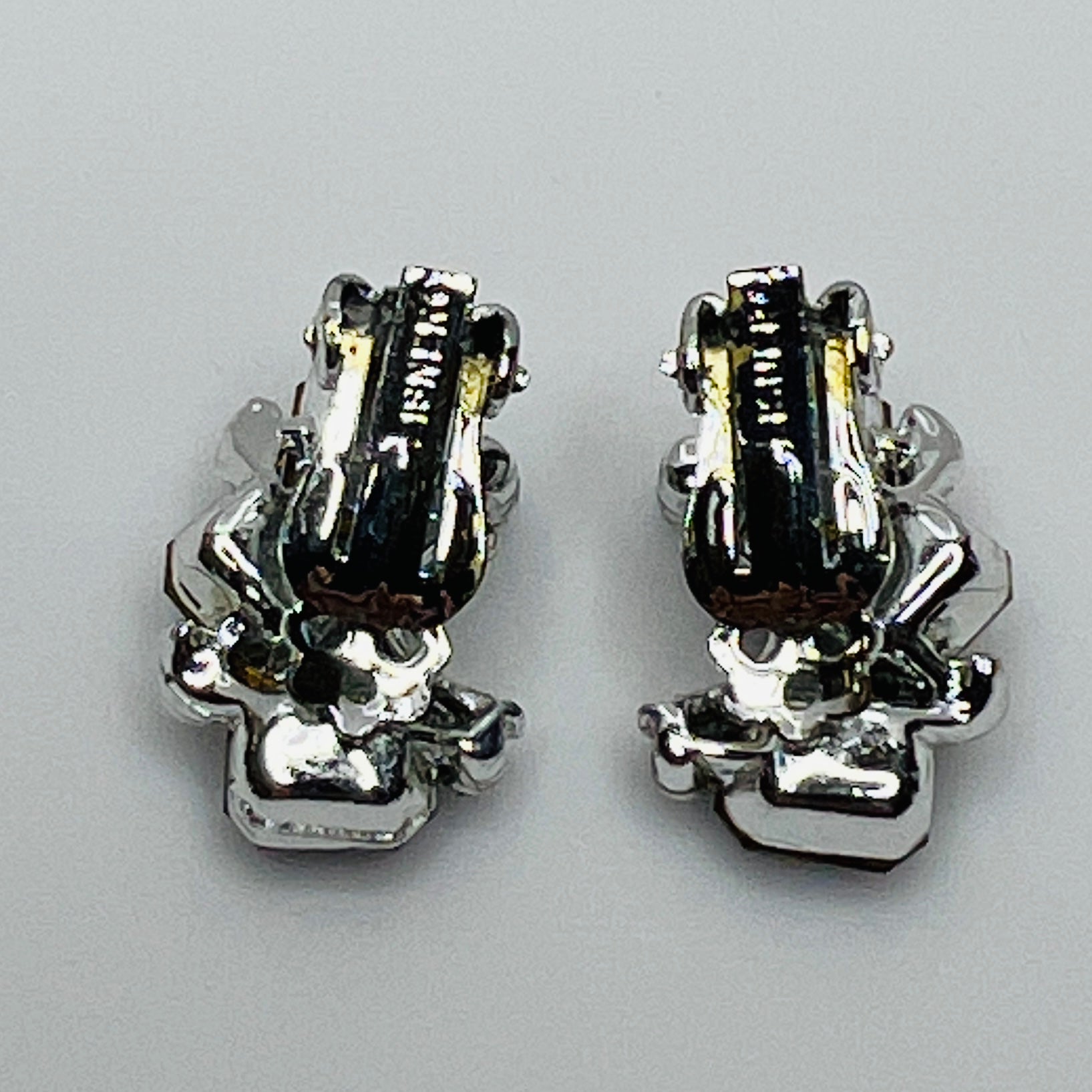 Lisner clip-on earrings with sapphire blue rhinestones and silver-tone setting