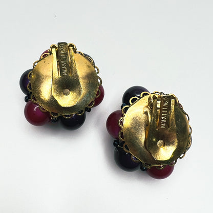 Reverse view of vintage Marvella dimensional bead cluster clip earrings with gold-tone metal settings.