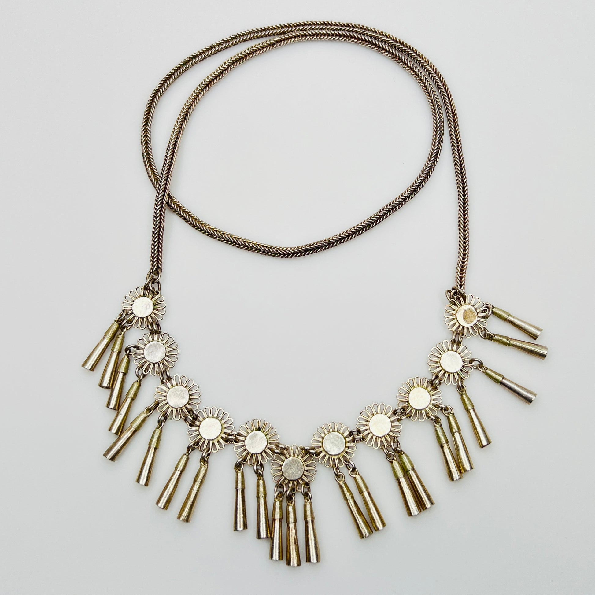 Vintage Miao Hmong silver tribal tassel necklace on display