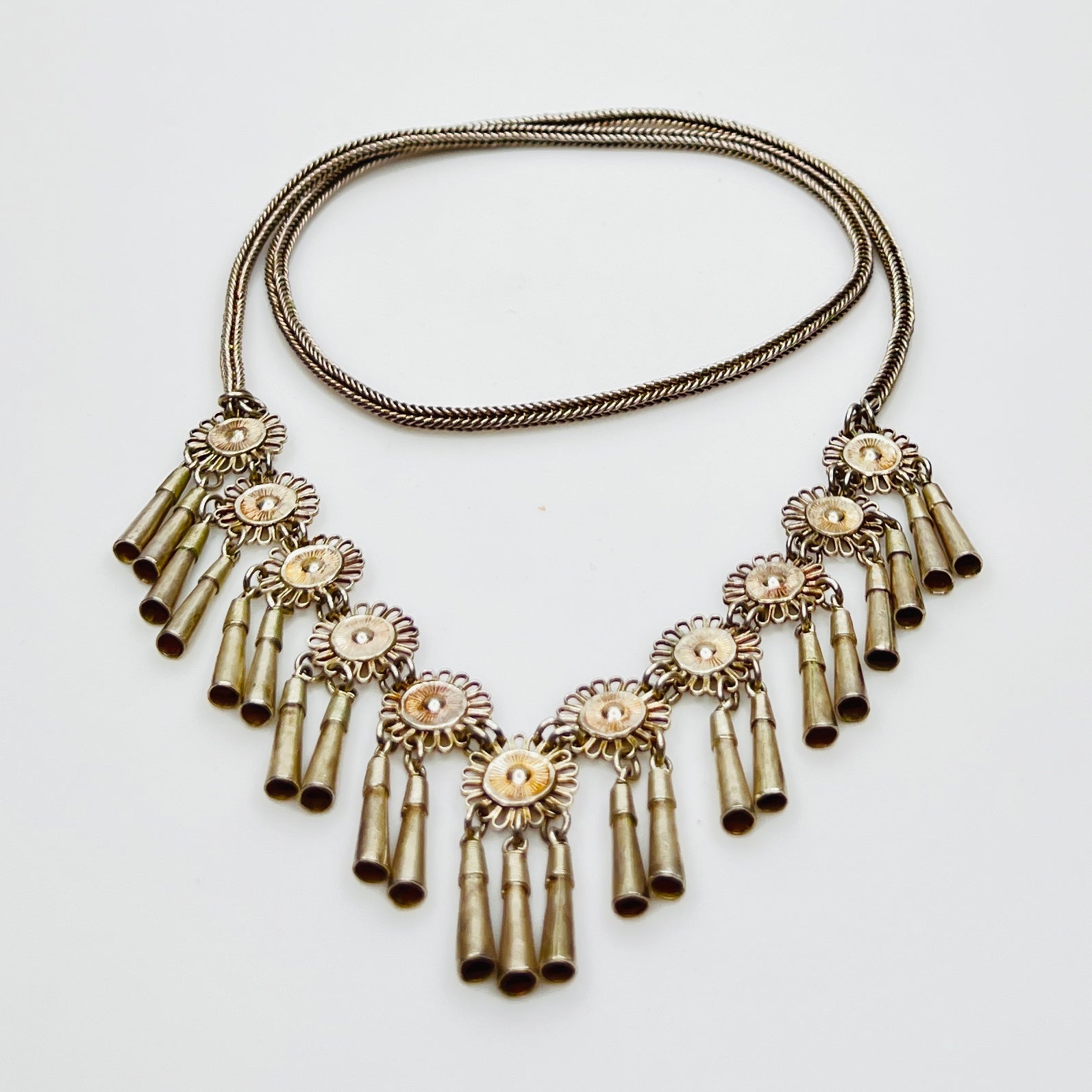 Vintage Miao Hmong silver tribal tassel necklace on display