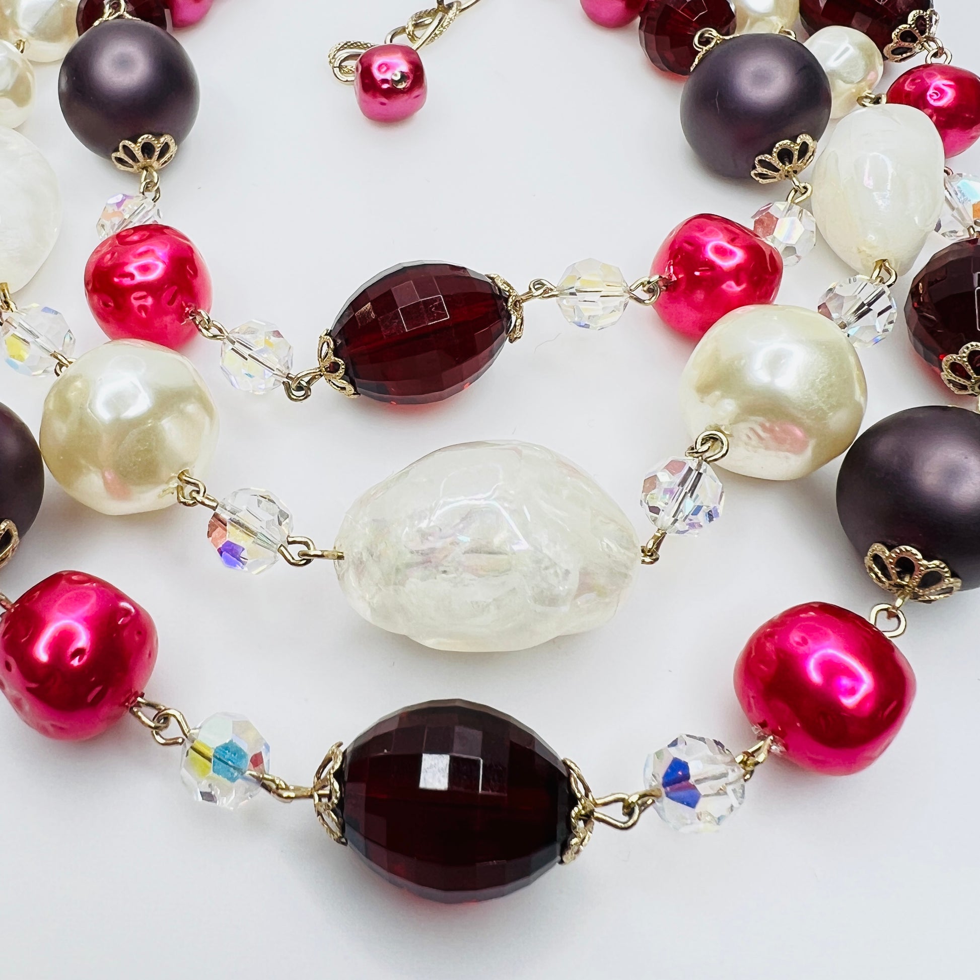 Close up of ruby red beads and aurora borealis crystals