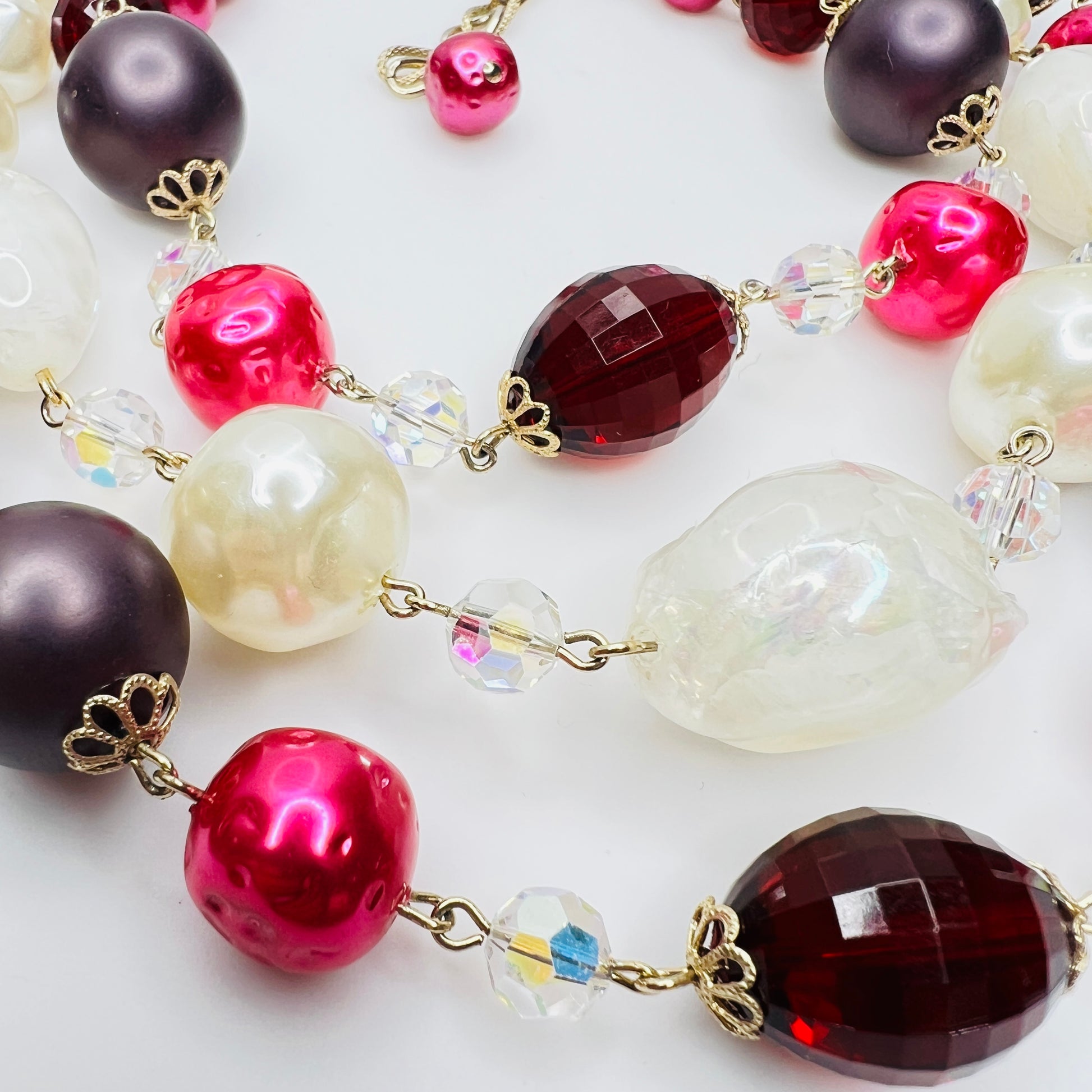 Close up of ruby red beads and aurora borealis crystals
