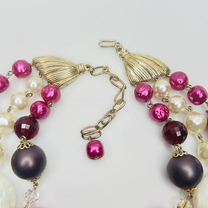 Gold tone clasp and chain extender detail
