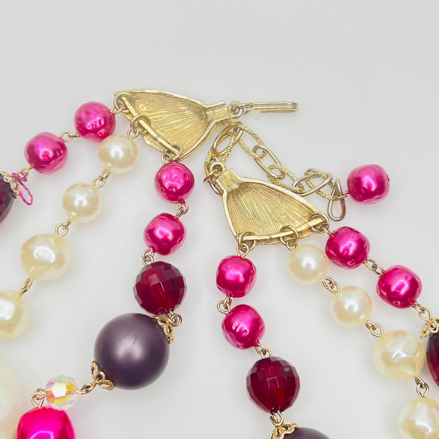 Gold tone clasp and chain extender detail