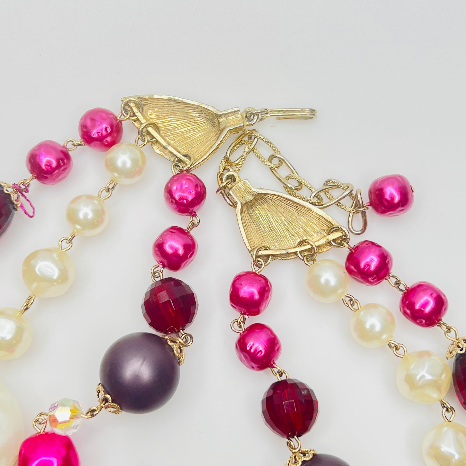 Gold tone clasp and chain extender detail