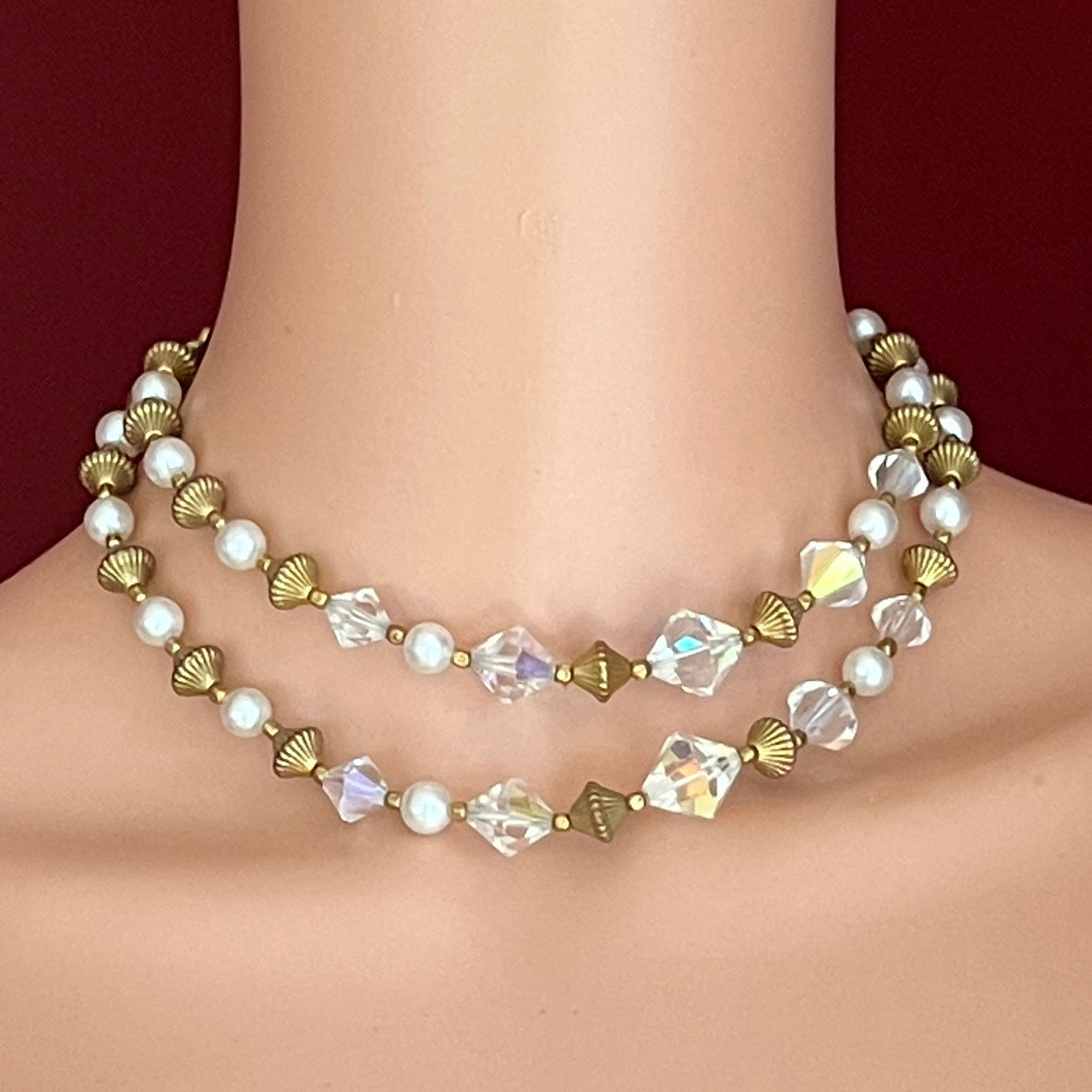 Mid-century layered necklace with aurora borealis crystals and pearls on mannequin