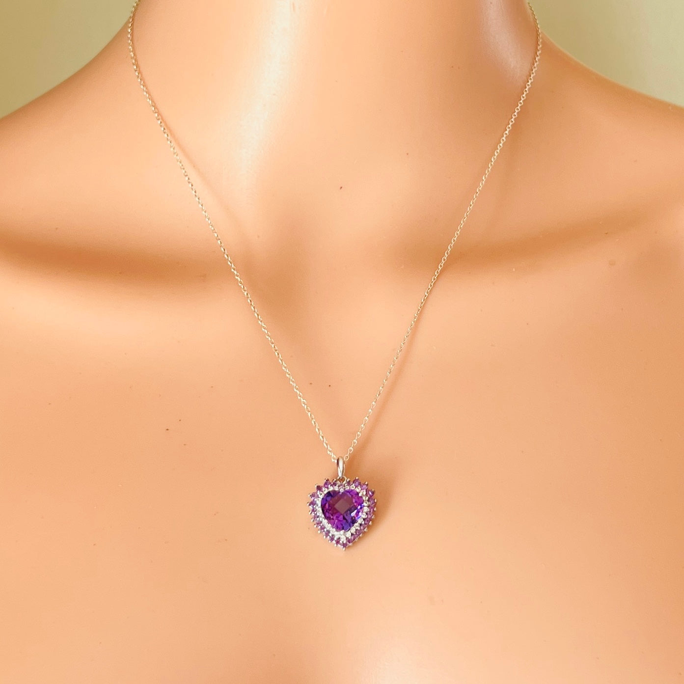 Vintage purple heart pendant necklace worn on mannequin