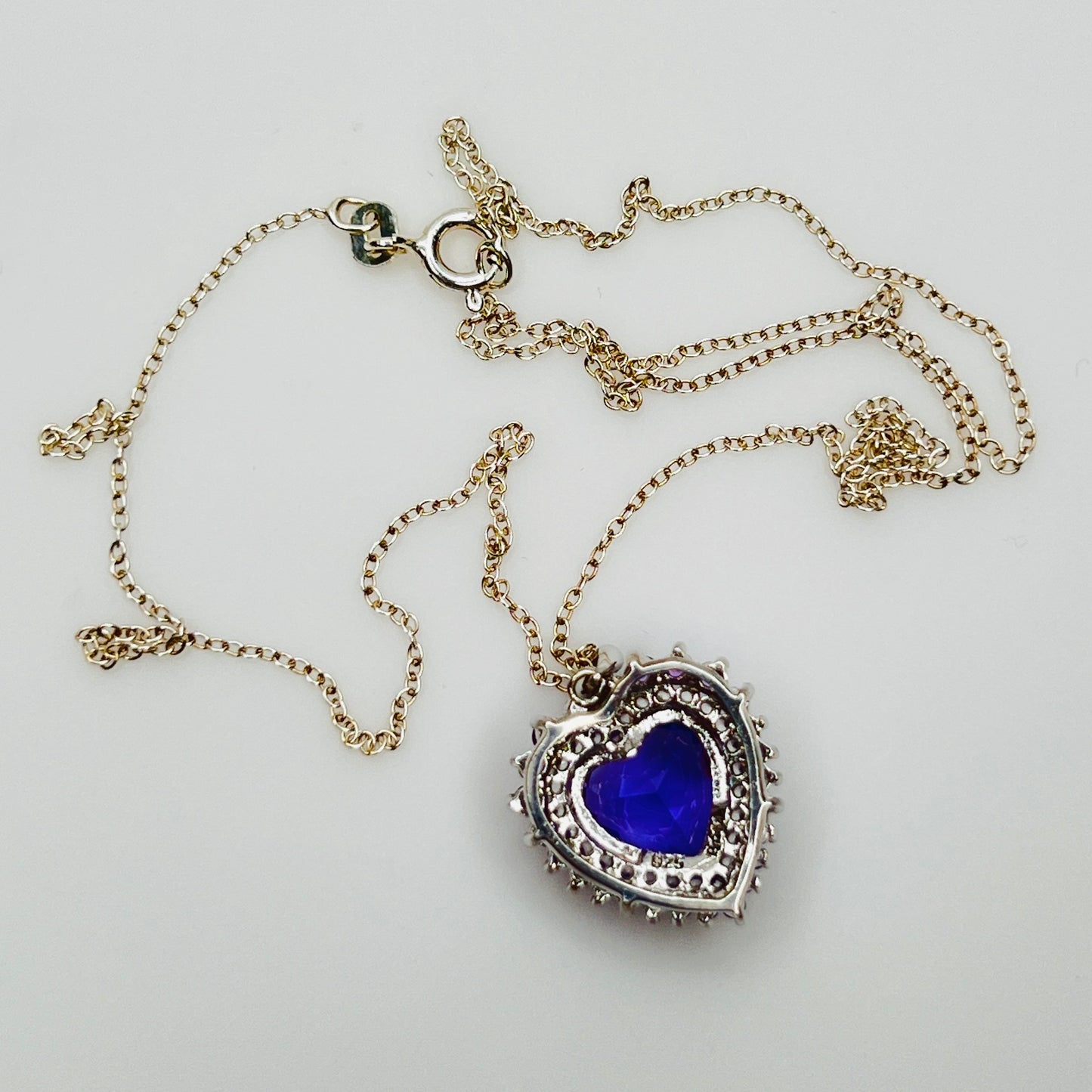 Back of pendant showing sterling silver setting and stones