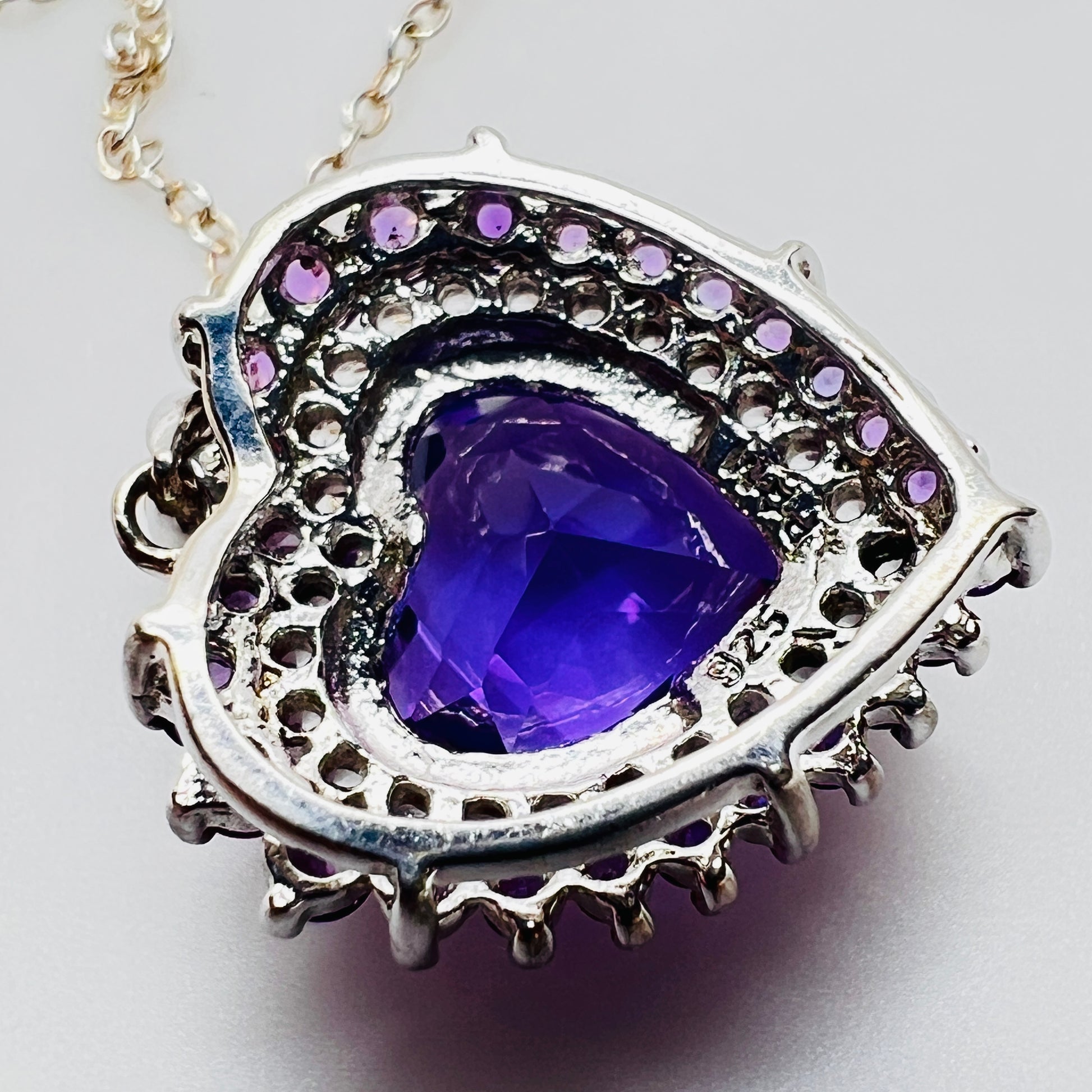 Back of pendant showing sterling silver setting and stones