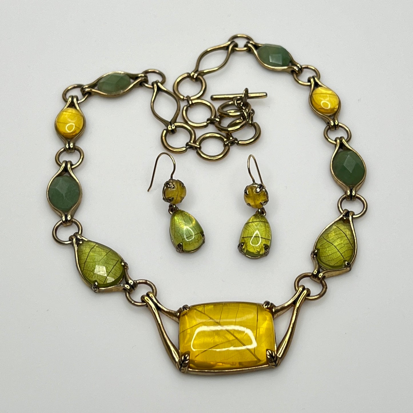 Vintage Monet necklace with green and yellow glass cabochons in gold-tone setting