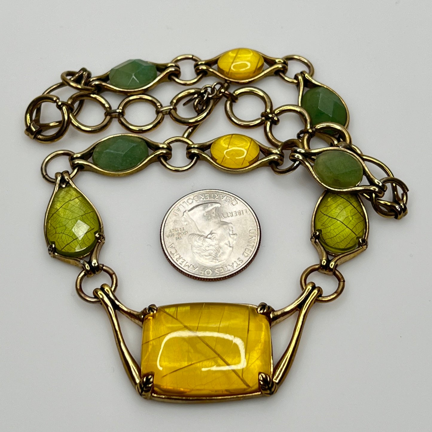 Vintage Monet necklace with green and yellow glass cabochons in gold-tone setting