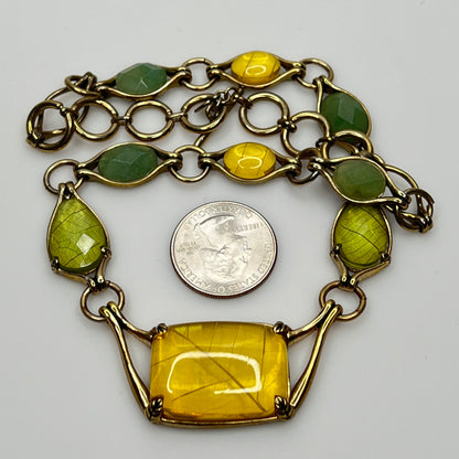 Vintage Monet necklace with green and yellow glass cabochons in gold-tone setting