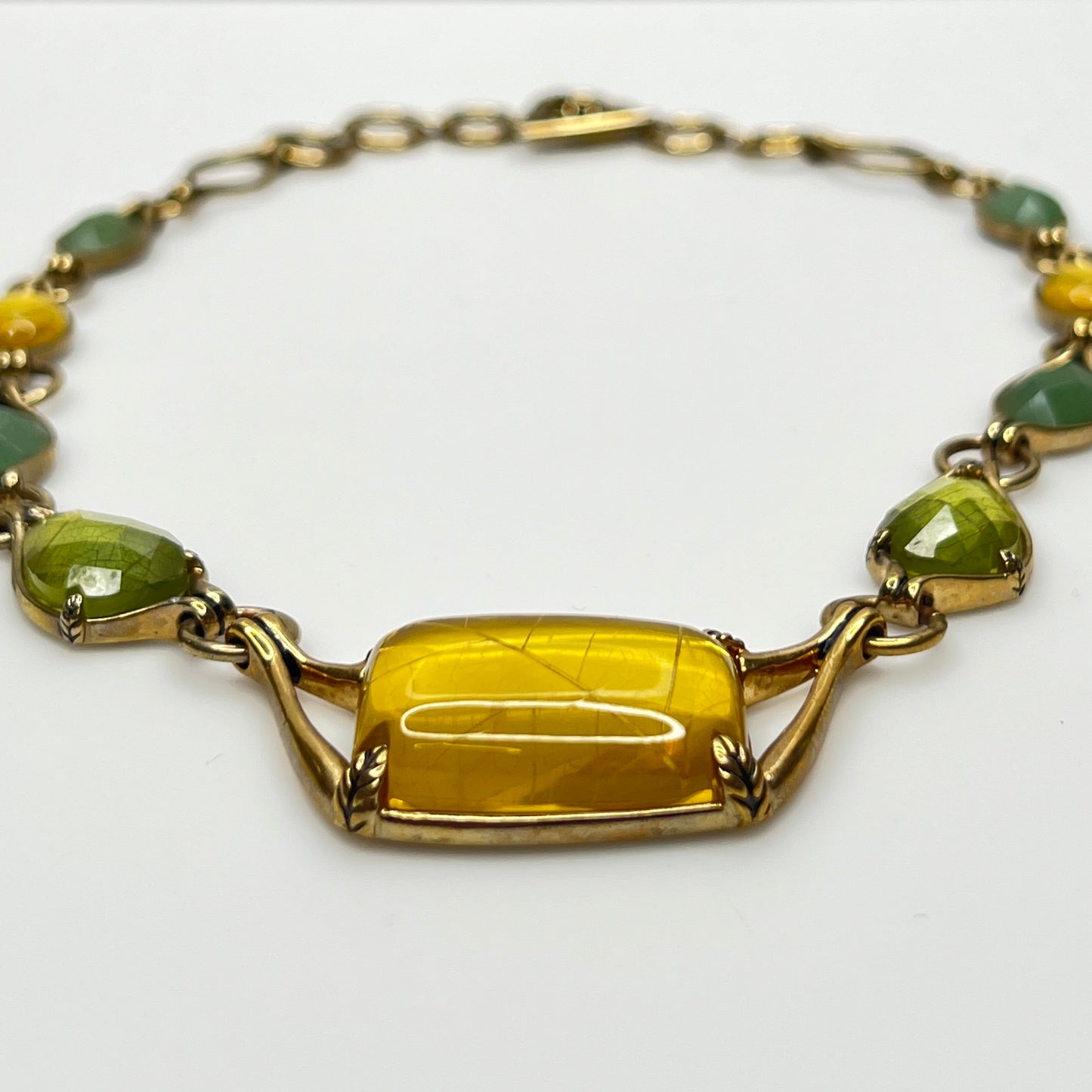 Vintage Monet necklace with green and yellow glass cabochons in gold-tone setting