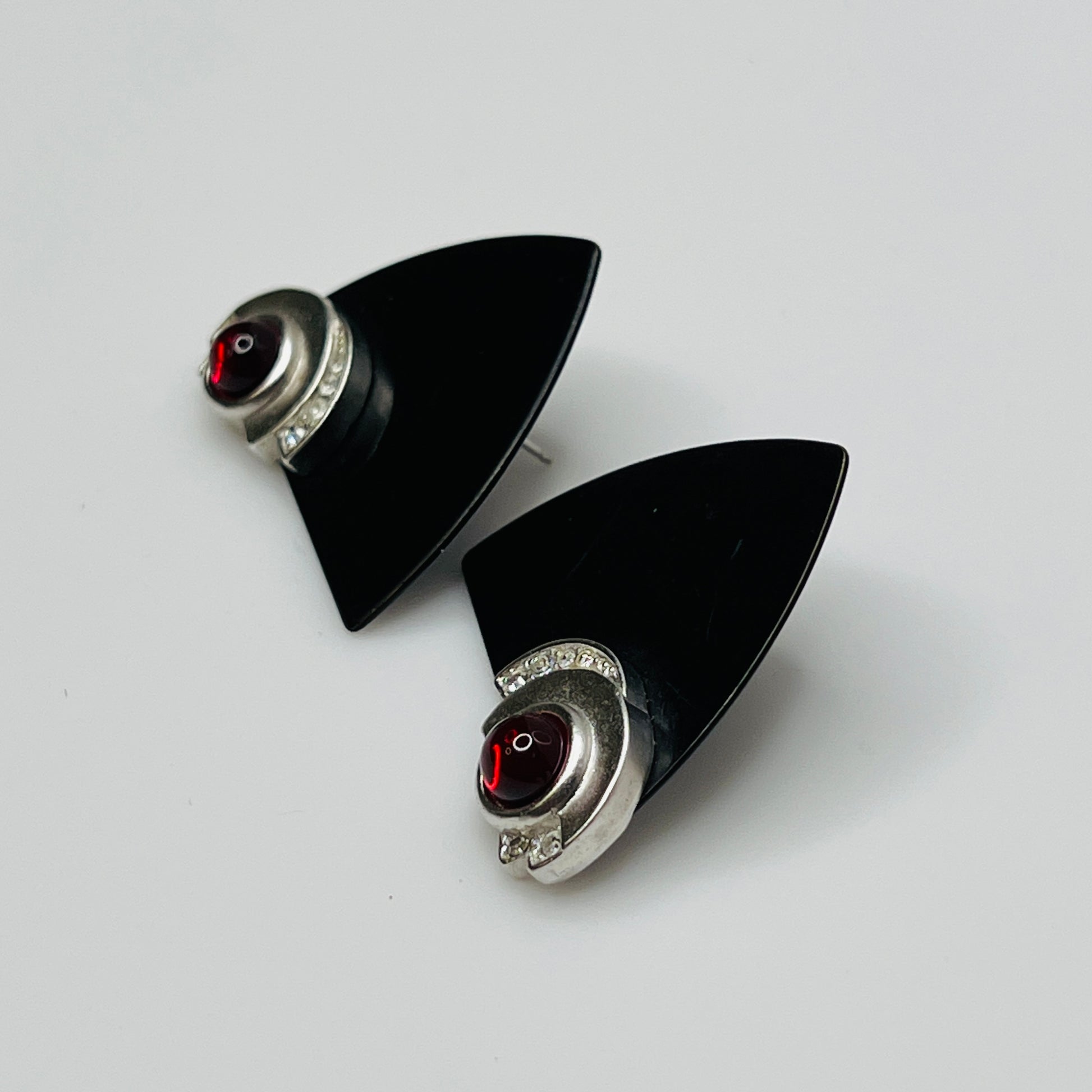 Pair of black triangular Monet earrings with red glass cabochon and rhinestones