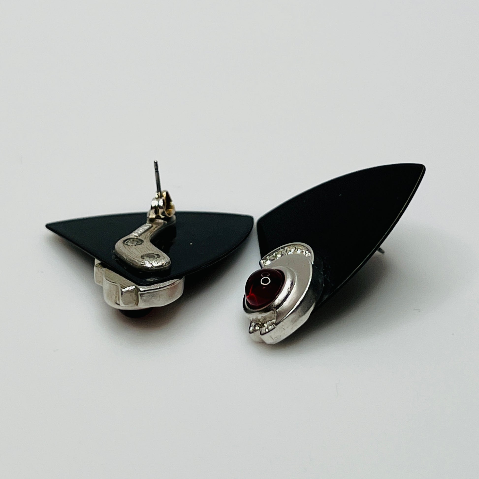 Pair of black triangular Monet earrings with red glass cabochon and rhinestones