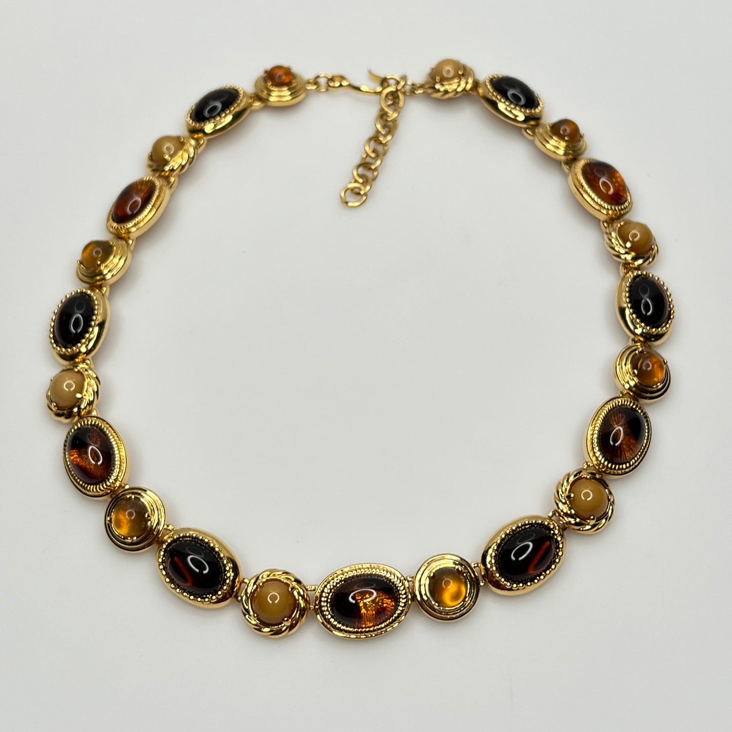 Overhead view of 1980s Monet necklace with adjustable clasp and oval stones