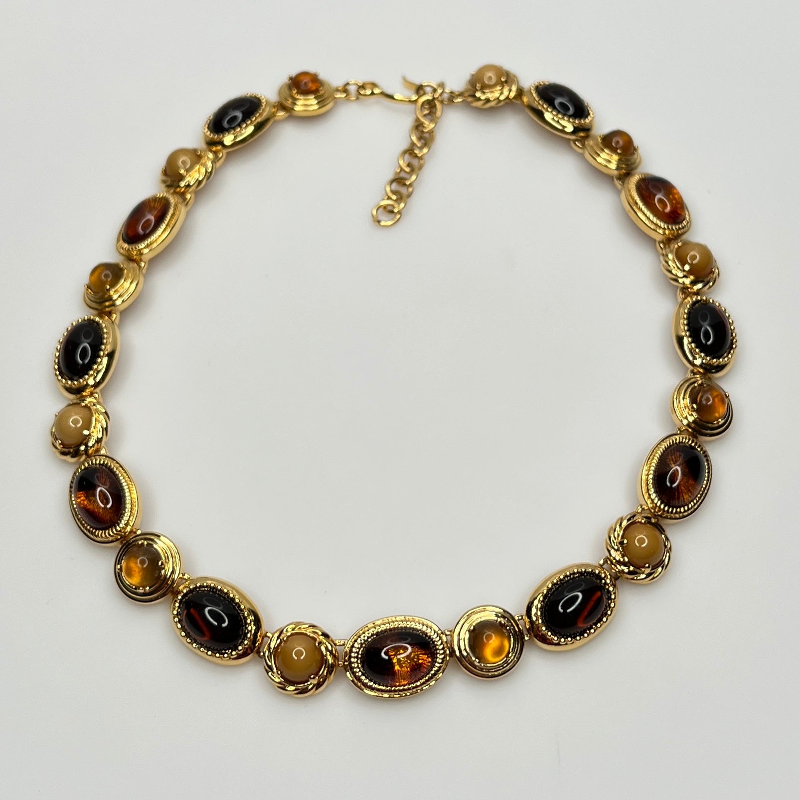 Overhead view of 1980s Monet necklace with adjustable clasp and oval stones