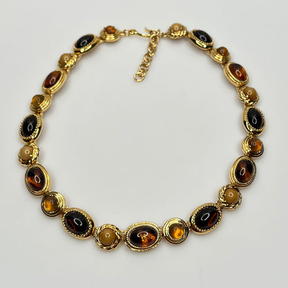 Overhead view of 1980s Monet necklace with adjustable clasp and oval stones