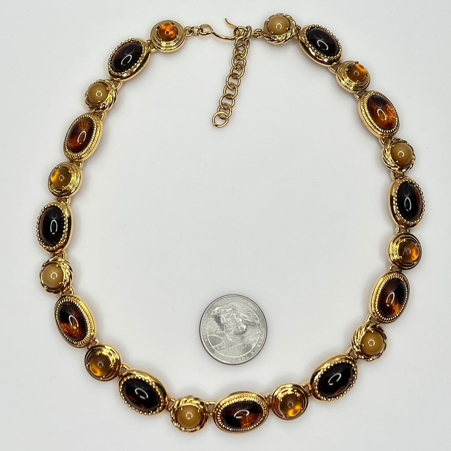 Overhead view of 1980s Monet necklace with adjustable clasp and oval stones