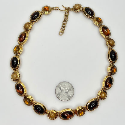 Overhead view of 1980s Monet necklace with adjustable clasp and oval stones