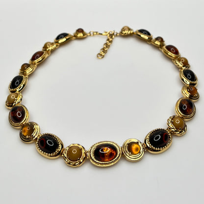Overhead view of 1980s Monet necklace with adjustable clasp and oval stones