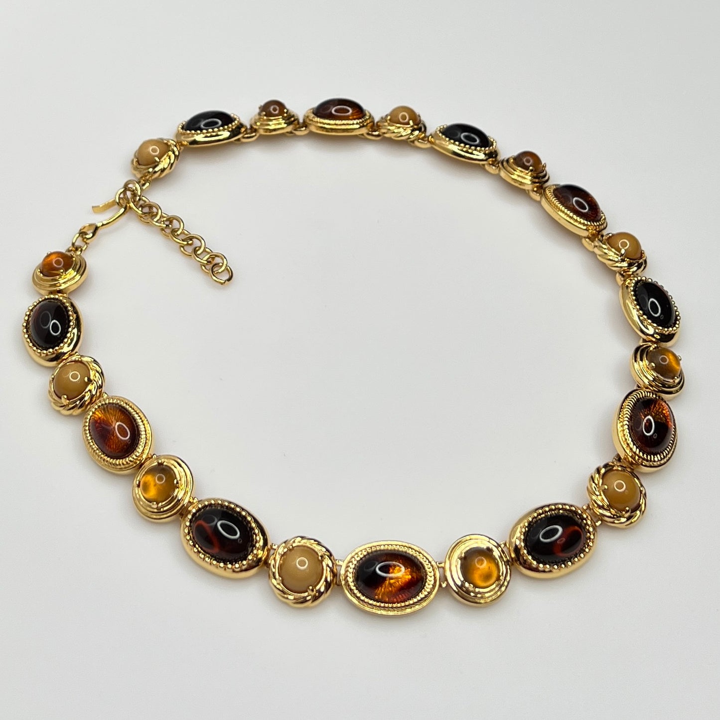 Overhead view of 1980s Monet necklace with adjustable clasp and oval stones