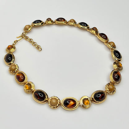Overhead view of 1980s Monet necklace with adjustable clasp and oval stones