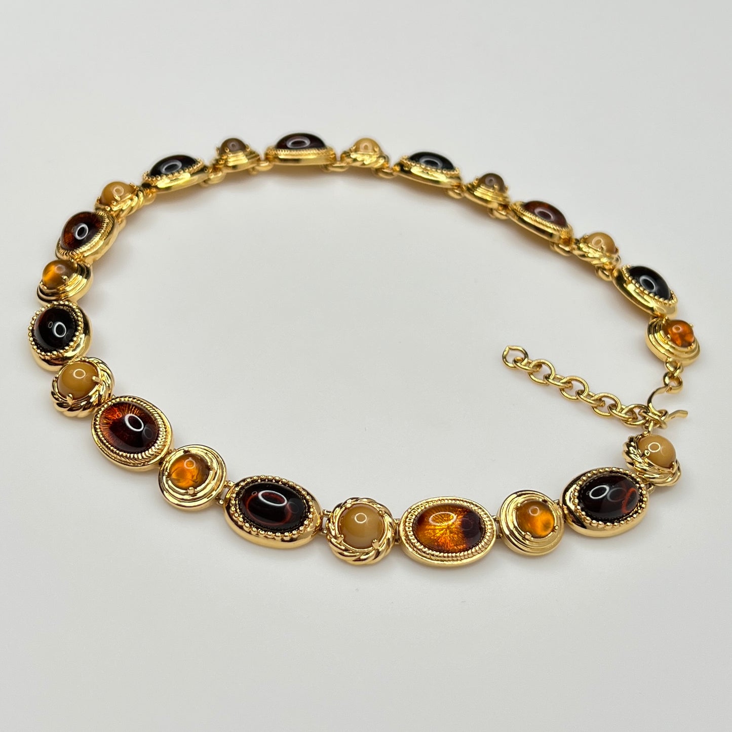 Overhead view of 1980s Monet necklace with adjustable clasp and oval stones