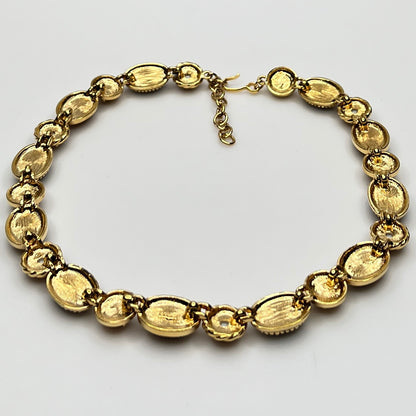 Overhead view of back of 1980s Monet necklace with adjustable clasp and oval stones