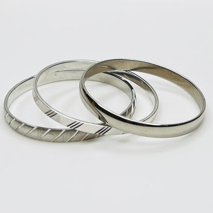 Monet silver tone bangle set with etched diagonal pattern