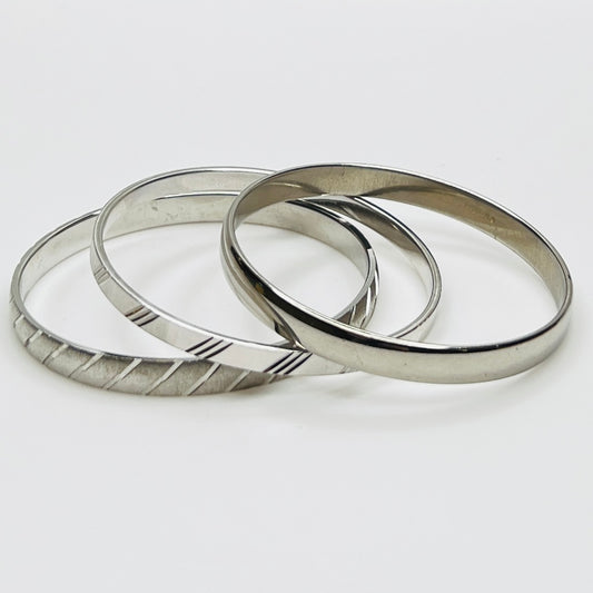 Monet silver tone bangle set with etched diagonal pattern