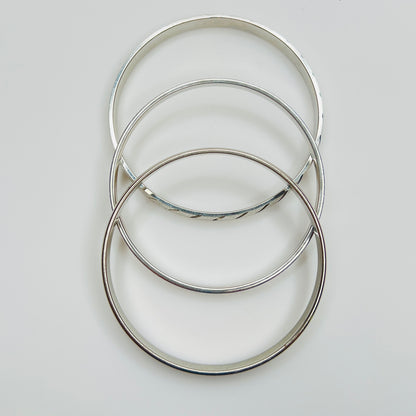 Monet silver tone bangle set with etched diagonal pattern