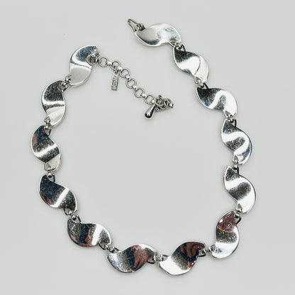 back view Close-up of silver Monet choker with curved leaf links