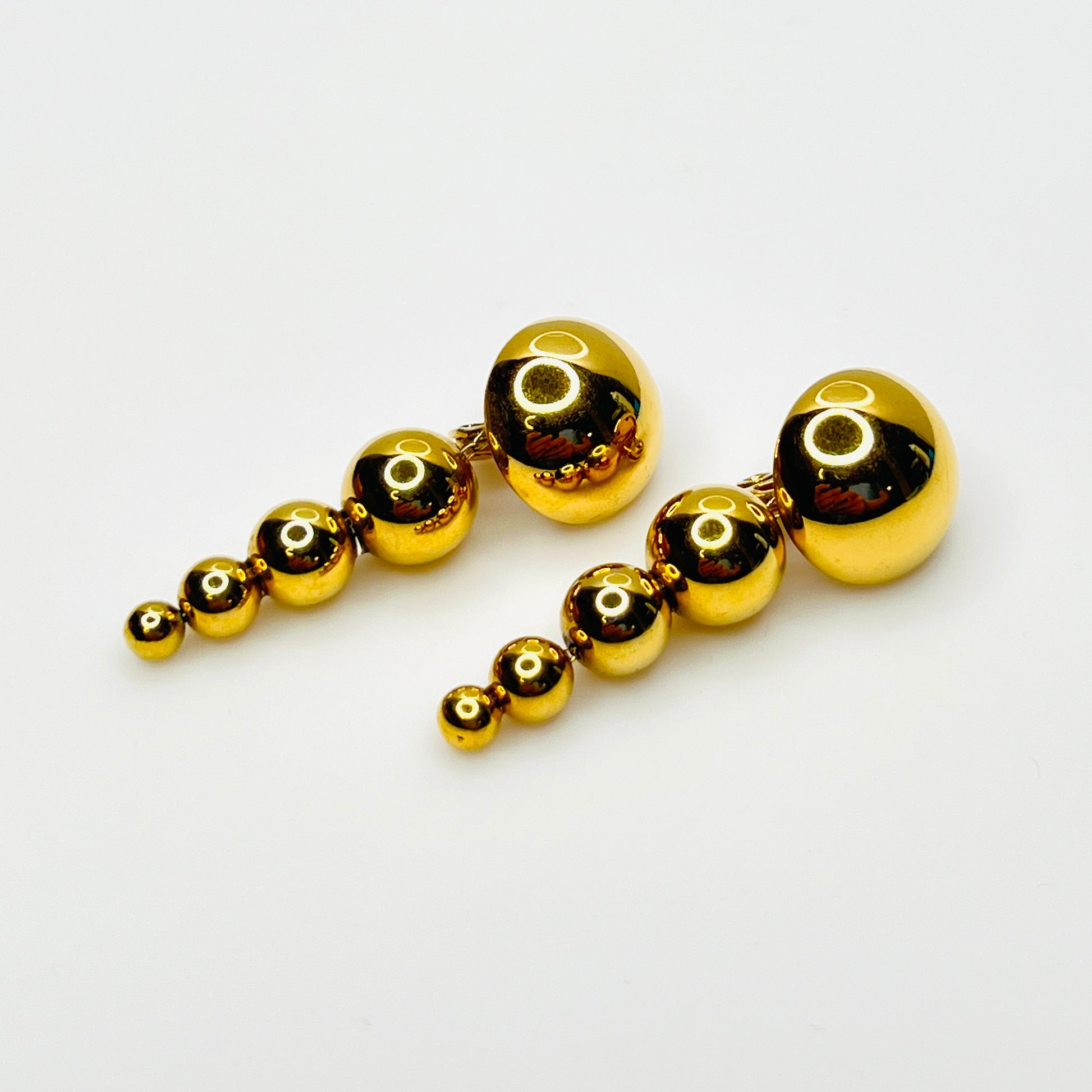 Vintage signed Monet gold-tone graduated bead dangle clip-on earrings