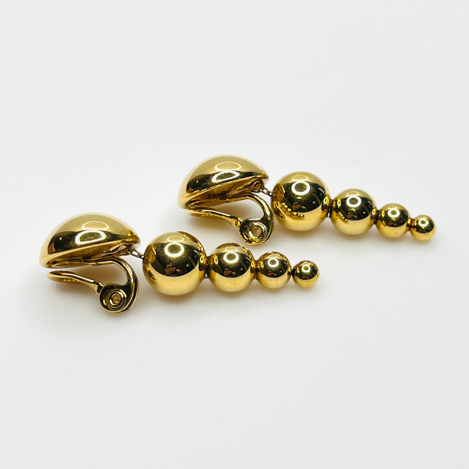 Side profile of vintage Monet gold-tone graduated bead earrings