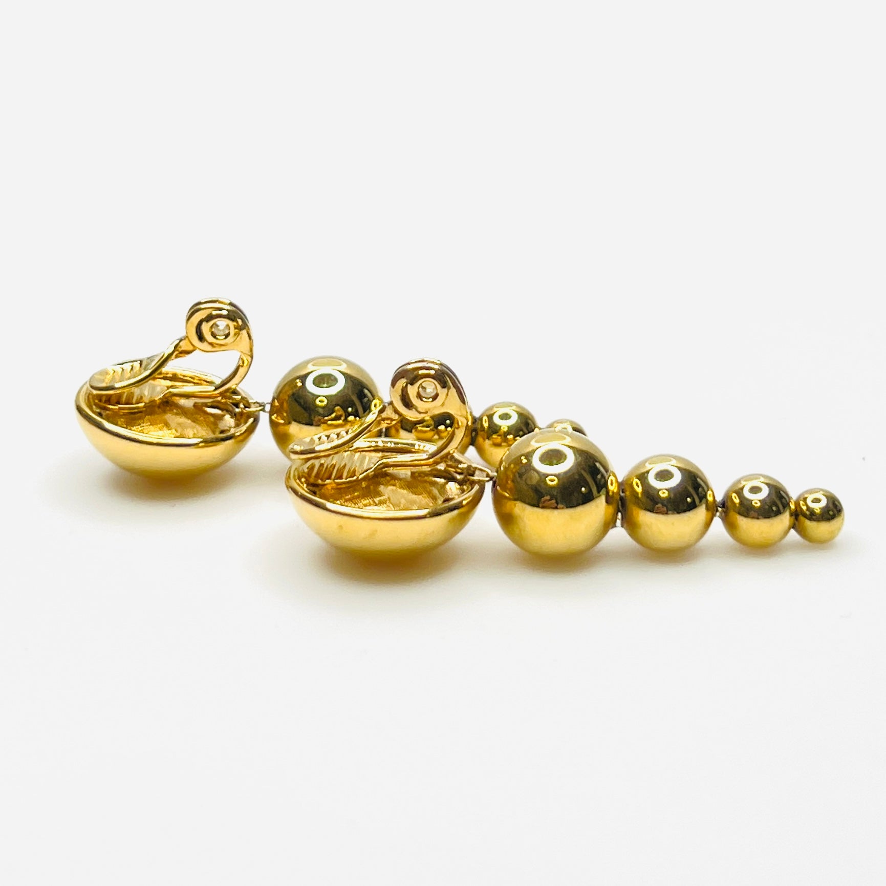 Side profile of vintage Monet gold-tone graduated bead earrings