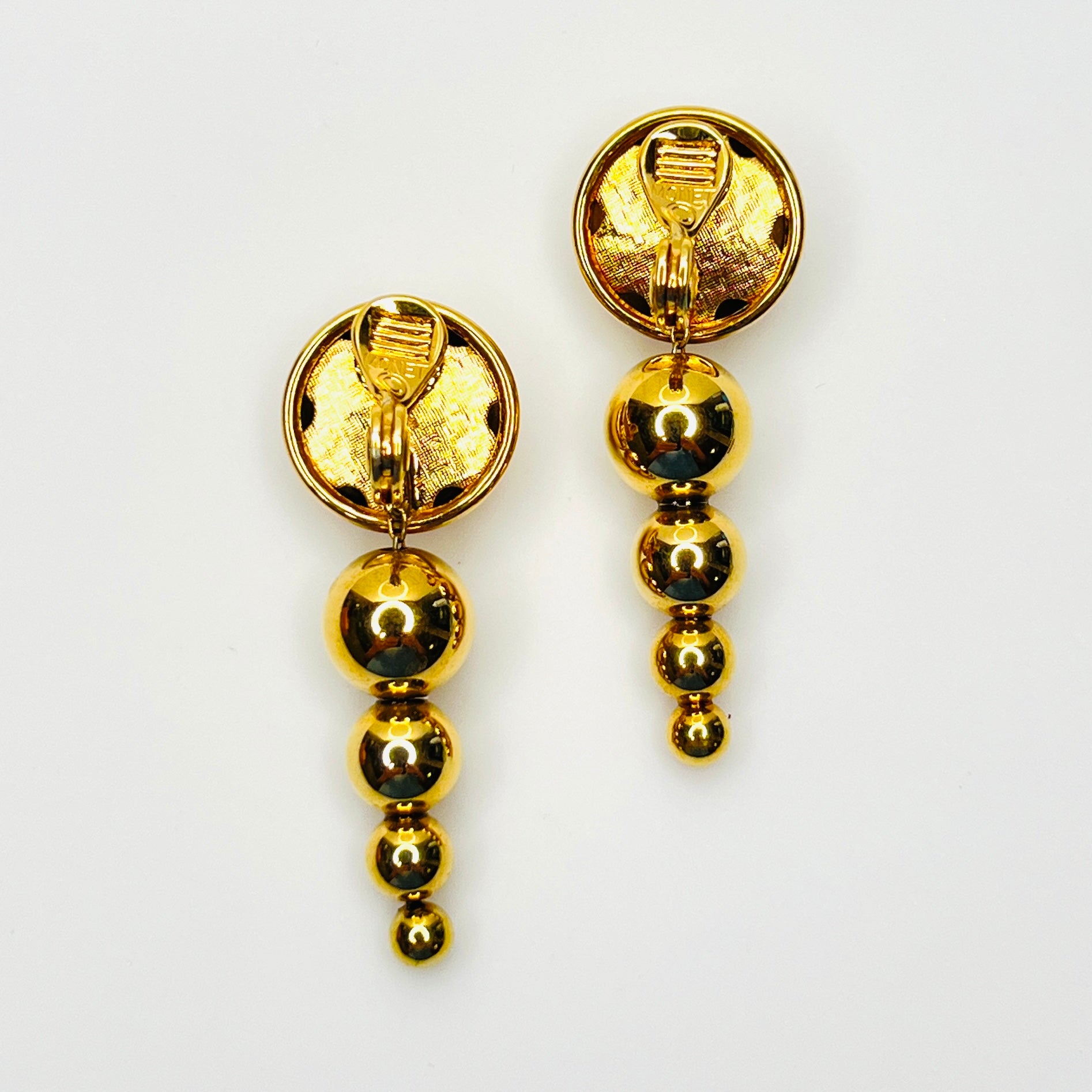 Back view of signed Monet graduated bead clip-on earrings