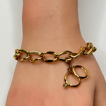 Gold-tone chain bracelet with rhinestone wedding ring charm by Monet