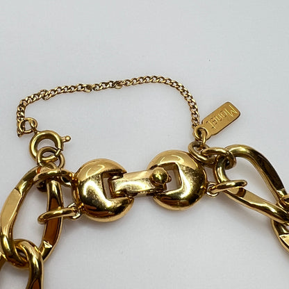 Gold-tone chain bracelet with rhinestone wedding ring charm by Monet