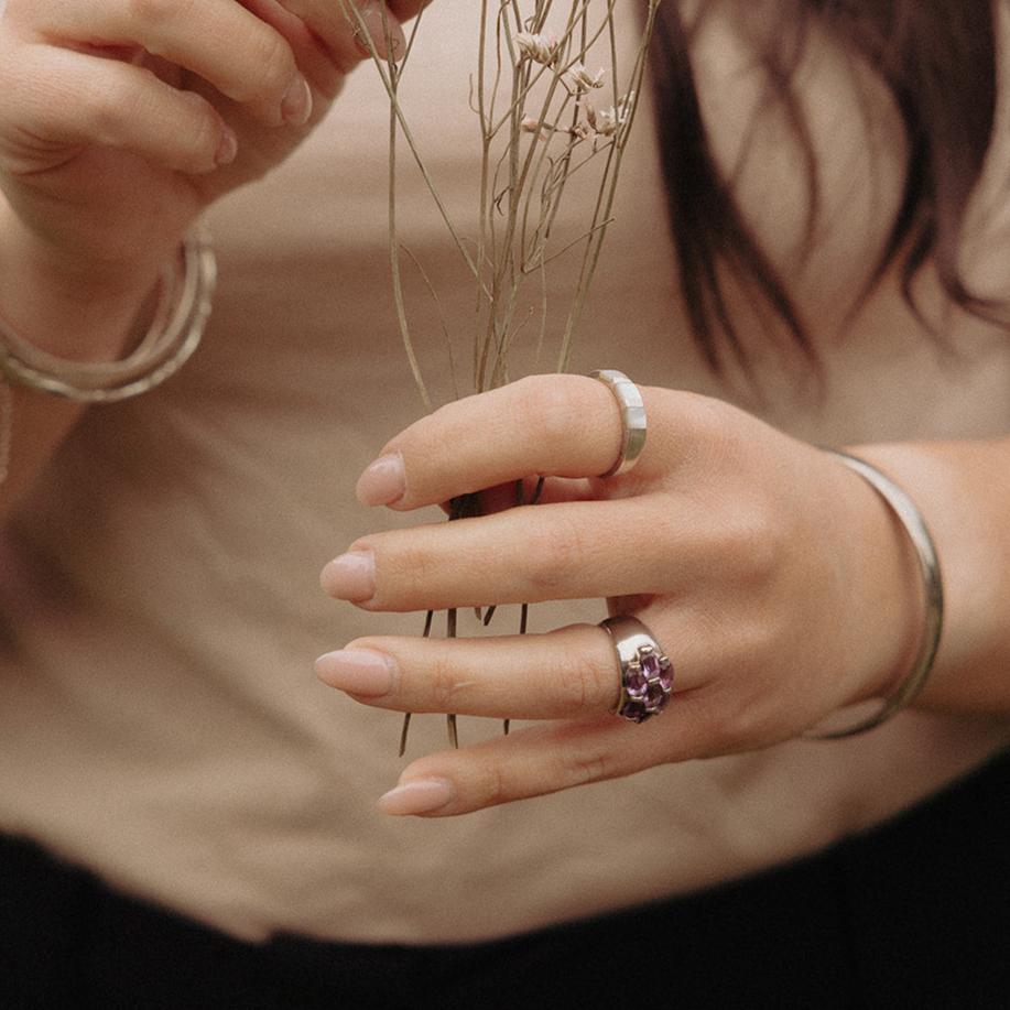1970s amethyst statement ring with thick band on finger
