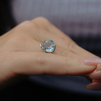 Vintage 10K gold ring with heart-shaped aquamarine gemstone on hand