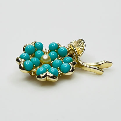 1960s floral brooch with faux turquoise cabochons and pearl center