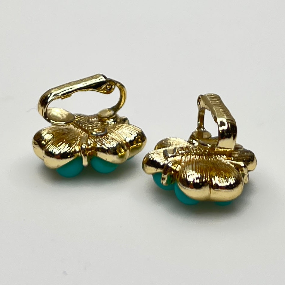 Matching clip-on earrings with gold-tone floral setting and turquoise beads