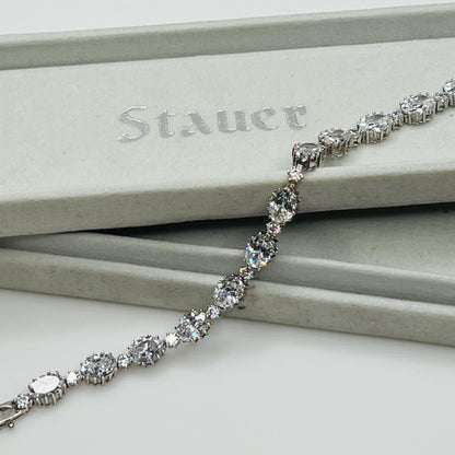 Silver bracelet with clear stones on a Stauer branded box