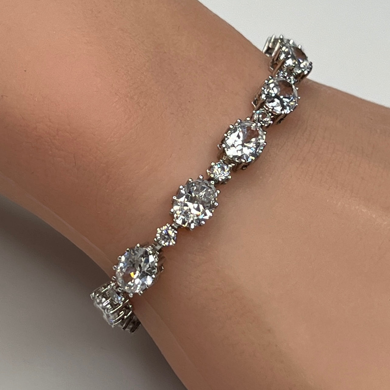 Stauer sterling silver CZ tennis bracelet on wrist