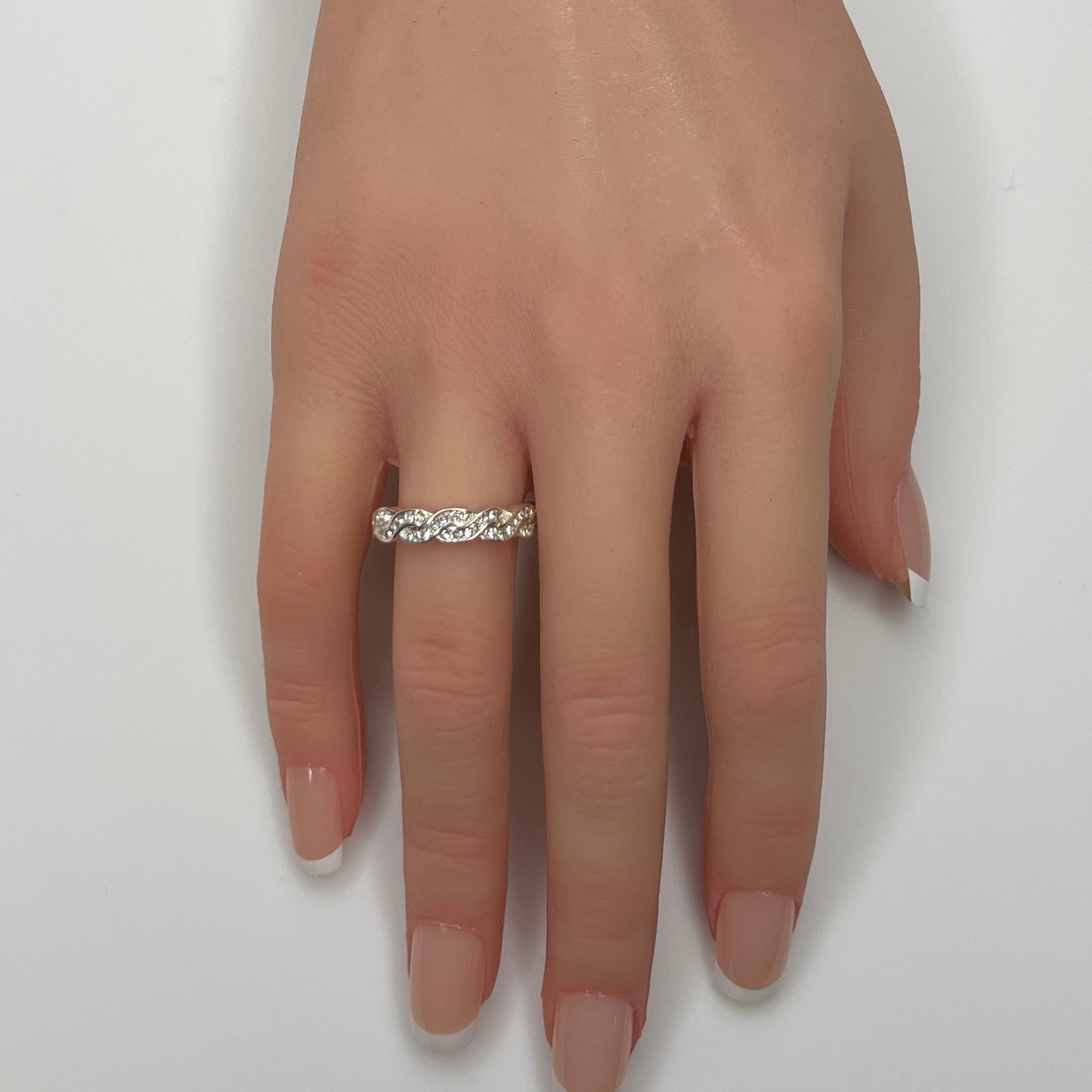 Braided crystal band ring shown on hand, size 7.5
