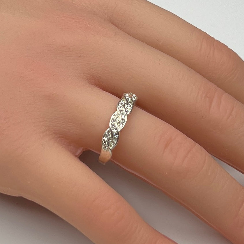 Braided crystal band ring shown on hand, size 7.5